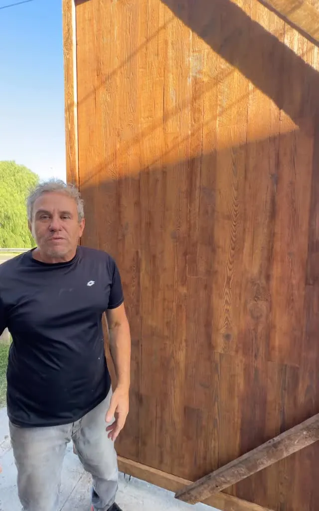 Our father standing beside a large finished door